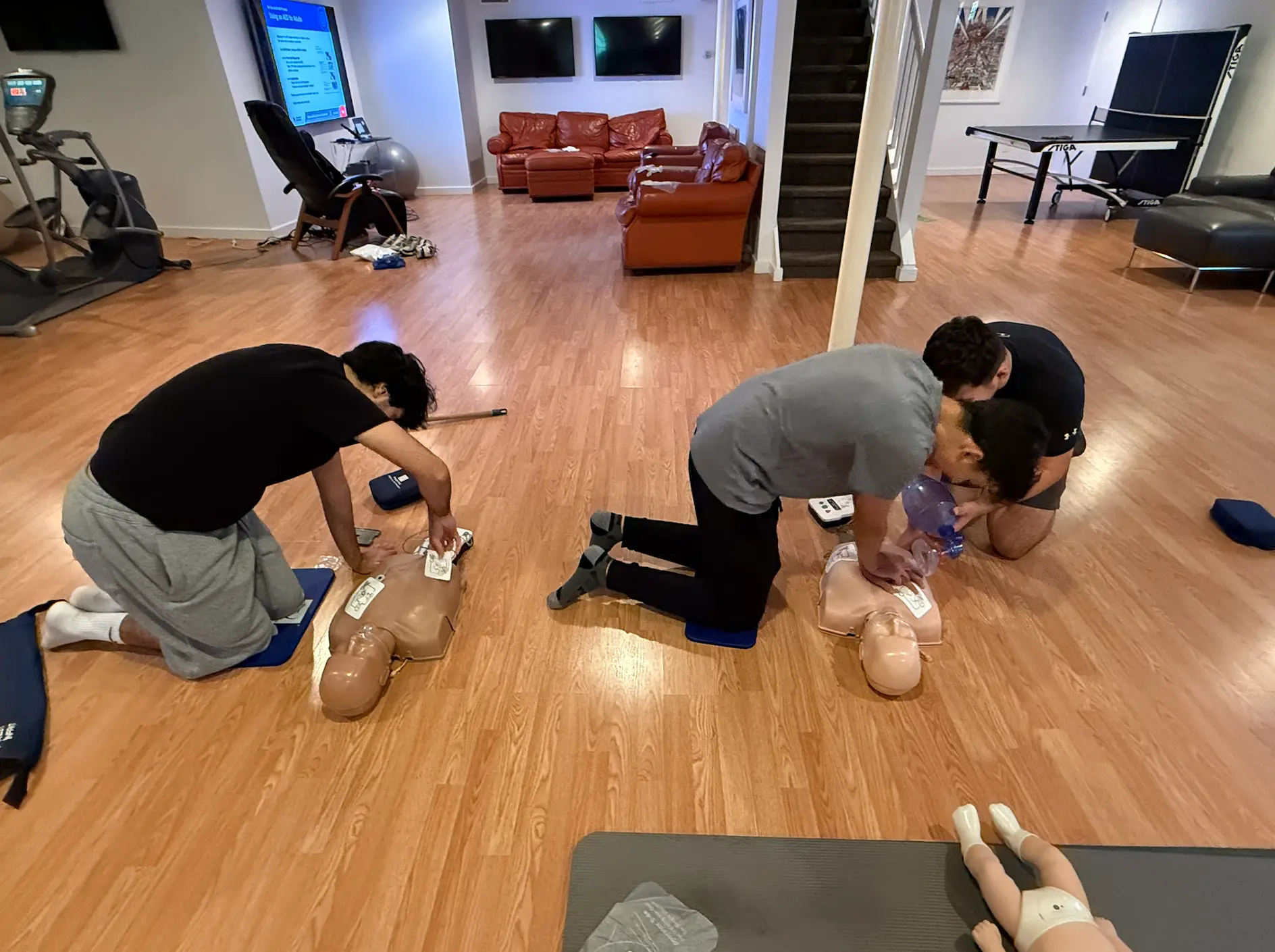 Students practicing CPR together during a class